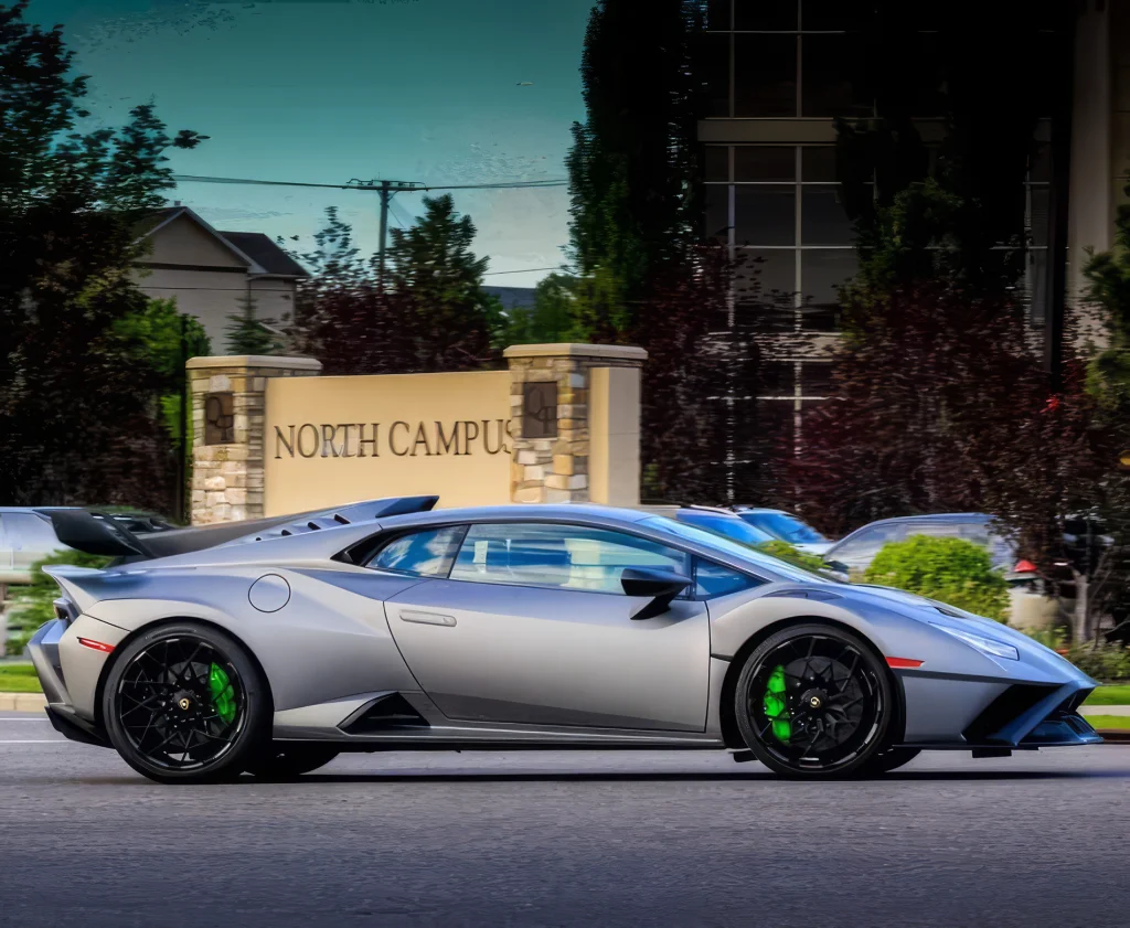 Lamborghini Huracan STO in profile, showing the fixed rear wing and green brake calipers